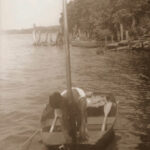 Picture of a boy boating on a river