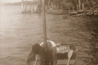 Picture of a boy boating on a river
