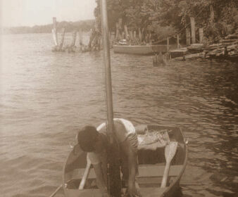 Picture of a boy boating on a river