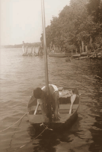 Picture of a boy boating on a river