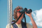 Picture of a woman using binoculars