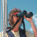 Picture of a woman using binoculars