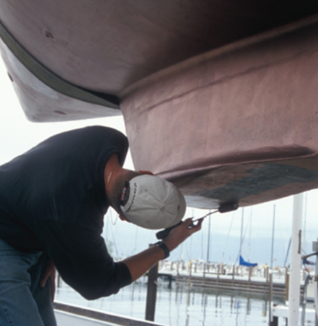 After your boat is in the slings, if your boatyard is a friendly one and you can be quick about it, apply paint in those areas that were previously inaccessible.