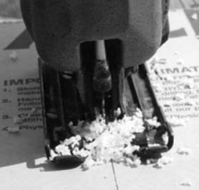 Use a variable-speed jigsaw on slow speed and a carbide-tipped blade. If you cut too fast, instead of producing chips, as shown, the plastic will melt.