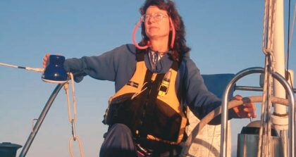 A woman steering a boat