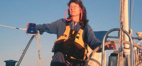 A woman steering a boat