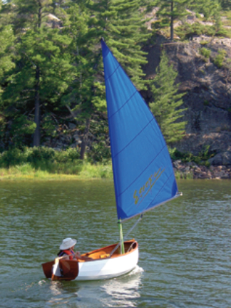 Nina cuts a colorful figure and a clean wake exploring an anchorage with her namesake.