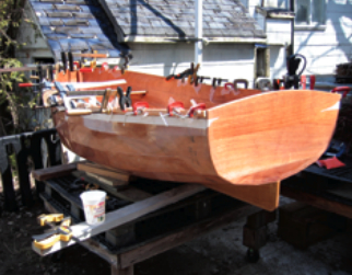 When it came time to fit the mahogany gunwale rails, Jonathon rounded up all the clamps in the neighborhood.