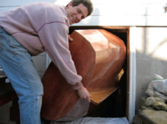 Even with the basement door and its frame removed, extracting the dinghy was a tight squeeze.