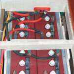 When we bought our Mason 43, the batteries were located beneath the V-berth, not exactly the best place to carry such weight. After removing the water heater, we were able to fit eight batteries beneath the cabin sole, right on the centerline between the mast and the engine.