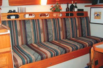 If there’s one thing that improves a boat during a refit, it’s a new set of cushion covers. Pat Brown figured this out in a hurry . . . and one thing more: to make it easy, staple the cloth to a plywood backing. This holds the cushion in place and sacrifices nothing in the way of comfort. It’s neat, trim, and fast.