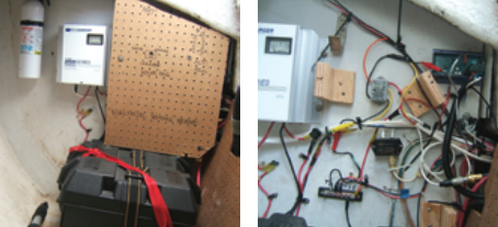 In the port cockpit locker, at left, are two flooded-cell 105Ah deep-cycle batteries. Above the batteries is a pegboard panel covering the solar and alternator regulators. An enlarged hole in the panel makes it possible to observe the status of the solar regulator. Outboard of the panel is an AC shorepower charger. All three sources of charging — solar, alternator, and AC shorepower — are together with the shortest possible cable runs. With the panel removed, at right, you can see the alternator regulator in the upper right-hand corner and the solar panel regulator to the left and down.