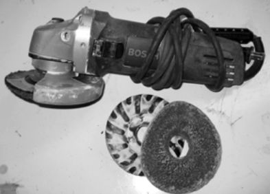 The Bosch 4 1/2-inch grinder with sanding pad and 36-grit disc is a good choice for removing very heavy material.
