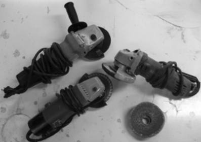Having a few 4 1/2-inch grinders around saves time spent changing wheels. These are set up for sanding, cutting, and grinding.