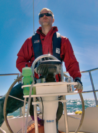 Author Ron Vanderwell at the helm. Thanks to the fishfinder, he knows just how fast he’s going and much, much more.