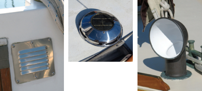 The louver vent to the cockpit locker, at left. The Nicro solar vent, above, pulls air through the spaces above and below the head door, helping to ventilate the rest of the boat as well. The chain locker in the forepeak lies just below a 4-inch cowl ventilator, at right.