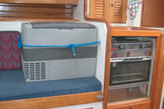 OK, so it takes up a bit of cabin space, and it’s not as elegant, perhaps, as a built-in refrigerator, but Carl points out that this costs $600, plus another $125 to hook it up and keep it in place when under way. Converting his icebox to refrigeration would have cost him closer to $6,000.