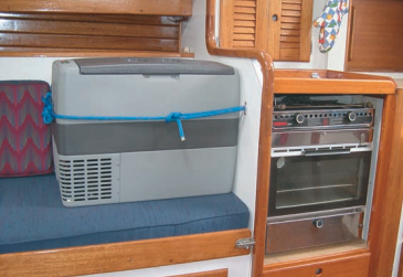OK, so it takes up a bit of cabin space, and it’s not as elegant, perhaps, as a built-in refrigerator, but Carl points out that this costs $600, plus another $125 to hook it up and keep it in place when under way. Converting his icebox to refrigeration would have cost him closer to $6,000.