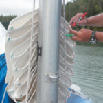 The colors left by permanent marker pens aren’t all that permanent: after a few years in the sun, they must be renewed. Keeping red marks to port and green ones to starboard means Mystic’s mainsail is folded the same way every time. After years of training, it practically folds itself when it’s dropped.