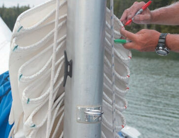 The colors left by permanent marker pens aren’t all that permanent: after a few years in the sun, they must be renewed. Keeping red marks to port and green ones to starboard means Mystic’s mainsail is folded the same way every time. After years of training, it practically folds itself when it’s dropped.