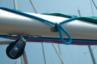 Starboard side of boom showing fender hook with the bungee hooked on.