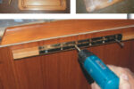 The advantage of a swing-up counter is that it will disappear when not needed. Gregg increased the counter space in his Pearson 28-2 by 50 percent with the addition of this 14- by 23-inch swing-up counter. Notice, at left, that the spacer allows room between the cutting board and the galley cabinet for the brace when folded.