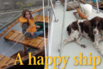 Richard’s granddaughter, Piper, at her happiest, swabbing down the dinghy fore and aft while good old Scout looks for birds.