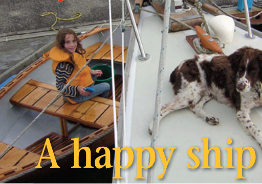 Richard’s granddaughter, Piper, at her happiest, swabbing down the dinghy fore and aft while good old Scout looks for birds.