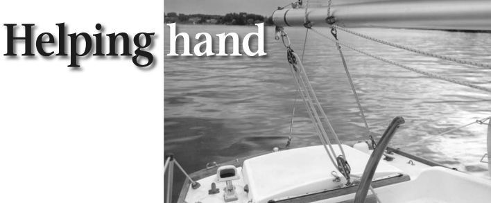 A bungee from boom to tiller steers the boat upwind under power.