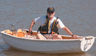 Picture of a man in a dinghy