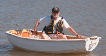 Picture of a man in a dinghy