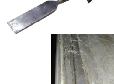 A scraper or box knife would have a tough time cutting through this hardened and gritty toerail adhesive, below, but removing it with a heated chisel was a breeze.