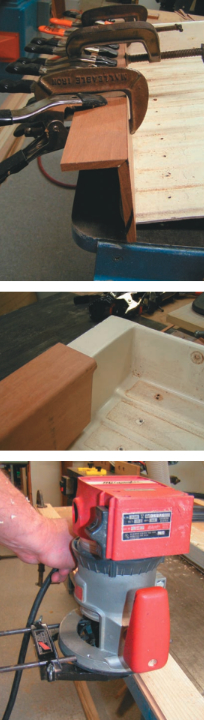 Dale clamped the end caps while the waterproof construction adhesive set up, top photo. The 45-degree miter joint is visible edge-on in this photo. The fit of the end caps over the old fiberglass pan is apparent in the middle photo. Dale used a router to cut the shiplap joint in the ash strips, bottom photo.