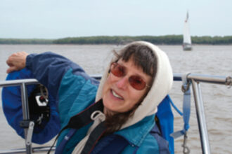 Karen aboard Higher Porpoise on Mark Twain Lake in northeastern Missouri in May 2008. The Mark Twain Lake Sailing Association marks its 20-year anniversary this year. Watch for an article about Higher Porpoise, a 1979 Tartan 37, and her sailors, Tom and Sandy Wells, in an upcoming issue of Good Old Boat.