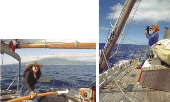 Never a dull moment under way: Lin steers as Taleisin sneaks through the wind shadow of Pico in the Azores, at left. Larry uses only traditional navigation methods, at right facing page.