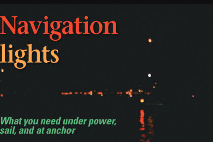 A typical nighttime dilemma: red light near the water with a white light above and a red light above that. What kind of boat is it? What is it doing? (For the rest of the story, see photo on Page 53).