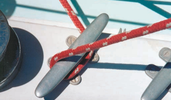 A safe hitch requires the bitter end to be held so the line may be let out or hauled in as the boat rises and falls.
