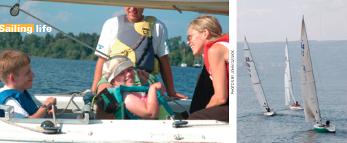 At Courage Center, two new sailors learn to sail from a certified sailing instructor, above left. This boat uses a simple adaptation: a line attached to the tiller allows a sailor with limited mobility to control the tiller, while the other sailor controls the mainsheet. Courage Center sailors in Duluth Harbor, Lake Superior, above right.