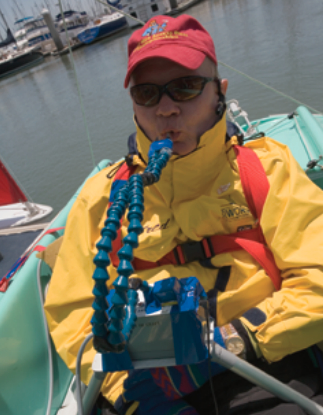 This BAADS sailor sips and puffs into one tube to control the mainsheet and sips and puffs into the other tube to control the tiller.