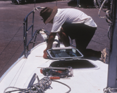 Stephen stripped the deck of everything but the mast before starting the actual work. Patience in clearing, repairing, and sanding makes the difference between an adequate job and a great one.