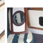 Fletcher, below, a brown Burmese from Cape Town, is Cooee’s ship cat. She grazes on potted grass daily. Jill has made a special hatchboard with a cat hole cutout, below right, just for Fletcher.