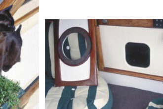 Fletcher, below, a brown Burmese from Cape Town, is Cooee’s ship cat. She grazes on potted grass daily. Jill has made a special hatchboard with a cat hole cutout, below right, just for Fletcher.