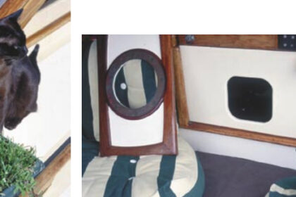 Fletcher, below, a brown Burmese from Cape Town, is Cooee’s ship cat. She grazes on potted grass daily. Jill has made a special hatchboard with a cat hole cutout, below right, just for Fletcher.