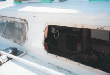 The exterior of the boat with the frames and glass removed.
