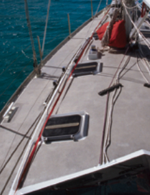 These jacklines, consisting of a 1/4-inch Spectra line threaded through the red webbing, are strong but won’t roll underfoot.