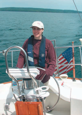 A satisfied Theresa at the helm. Is she smiling because she’s got the wheel or because morning sickness never sent her running to the rail to feed the Lake Superior fish?