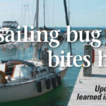 Theresa docks the boat, her first assignment while taking the Sailboats Inc. Charter Certification Course in Bayfield, Wisconsin. Theresa and three other students practiced maneuvers using a C&C 29 named Jubilee.