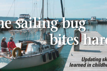 Theresa docks the boat, her first assignment while taking the Sailboats Inc. Charter Certification Course in Bayfield, Wisconsin. Theresa and three other students practiced maneuvers using a C&C 29 named Jubilee.