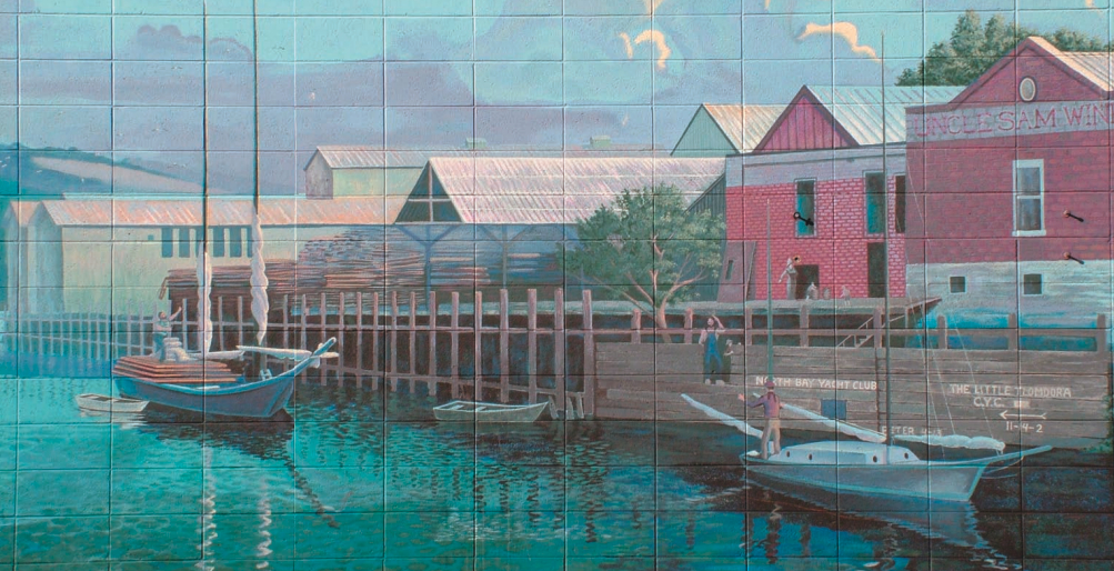 This is a partial view of a mural on Main Street in Napa, California, which evokes memories of the harbor as it was in Napa in the 1800s. The mural is signed by Steve Della Maggiora and Susan Clifford and is dated the summer of 1994.