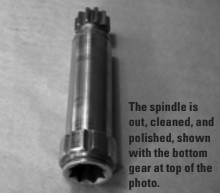 The spindle is out, cleaned, and polished, shown with the bottom gear at top of the photo.